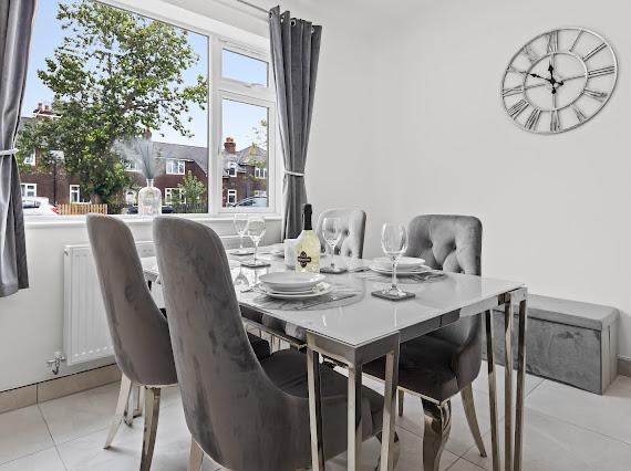 Dining room styled with velvet chairs and table setting