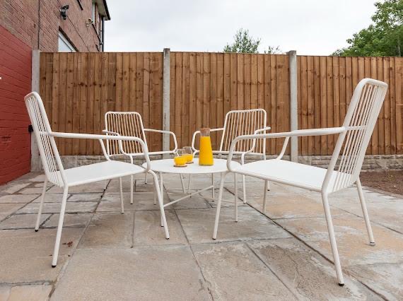 Garden patio styled with outdoor seating set